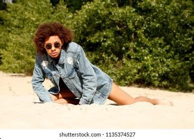 round sunglasses with denim jacket